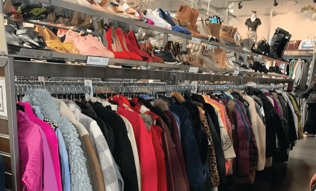Cheap second hand fashion women's clothes at garage sale Stock